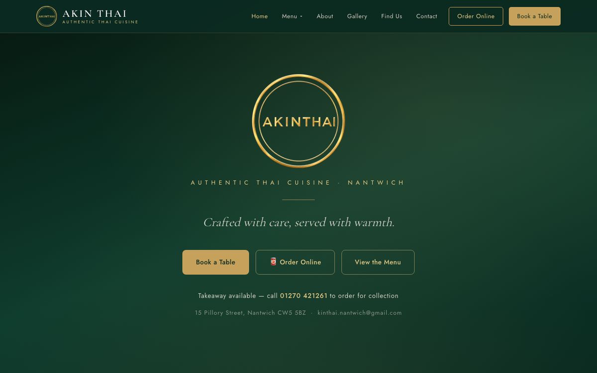 Akin Thai website on a laptop